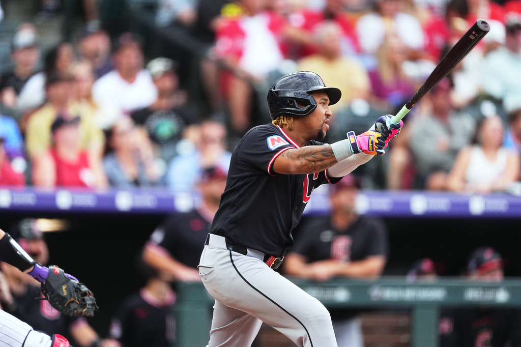 Cleveland Guardians' José Ramírez flies out against Colorado Rockies starting pitcher Gabriel Hughes in the first inning of a baseball game Saturday, Aug. 22, 2026, in Denver. (AP Photo/David Zalubowski)