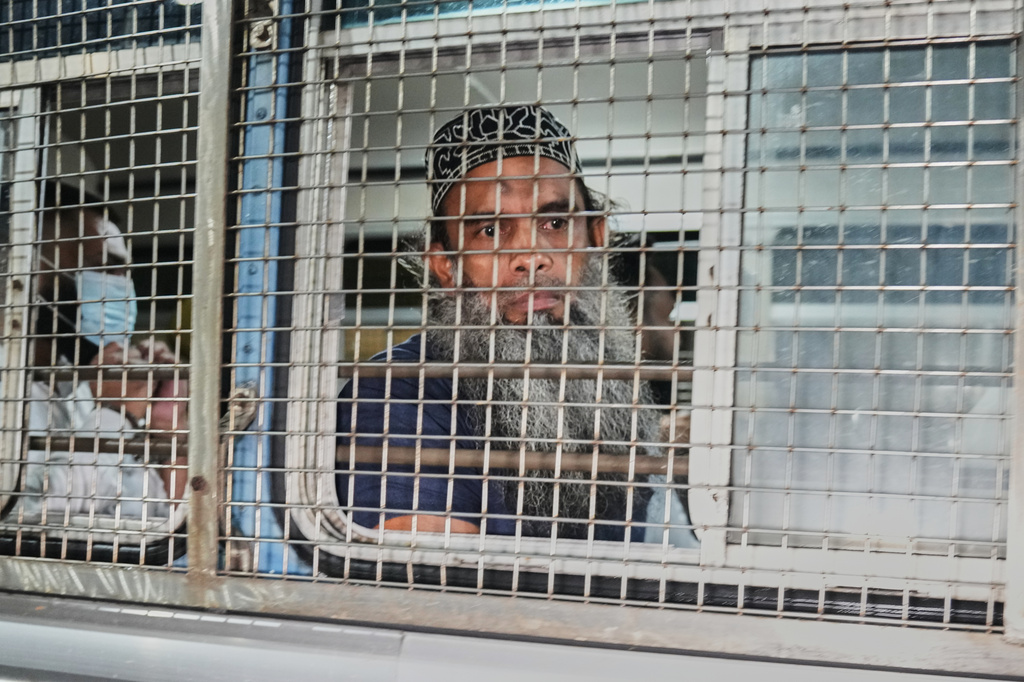 Unidentified men convicted for their involvement in the 2019 Easter bombings are escorted to a prison in Colombo, Wednesday, Sept. 23, 2026. (AP Photo/Eranga Jayawardena)