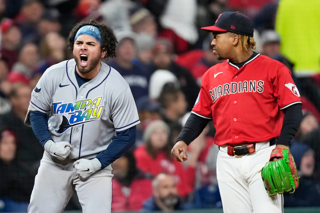 Tampa Bay Rays' Jonathan Aranda celebrates after RBI-single as Cleveland Guardians third baseman Jos&eacute; Ram&iacute;rez looks on during the seventh inning in Game 4 of an American League Championship Series baseball game in Cleveland, Saturday, Oct. 17, 2026. (AP Photo/David J. Phillip)