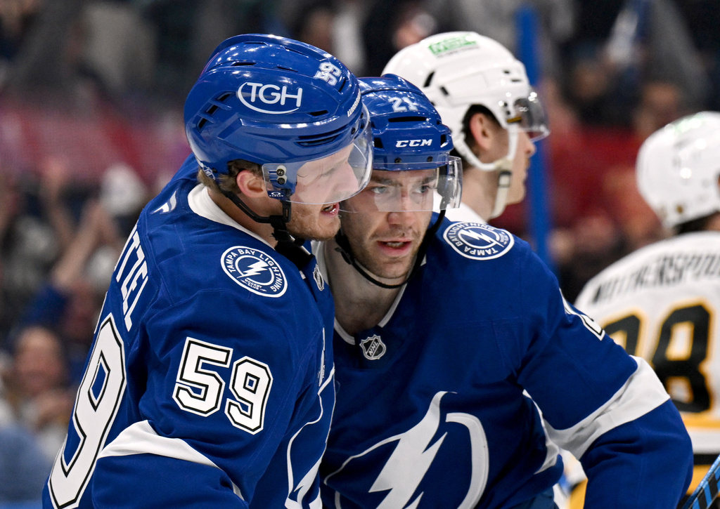 Tampa Bay Lightning center Jake Guentzel (59) and center Brayden Point (21) celebrate Point's goal during the second period of an NHL hockey game, Thursday, April 2, 2026, in Tampa, Fla. (AP Photo/Jason Behnken)