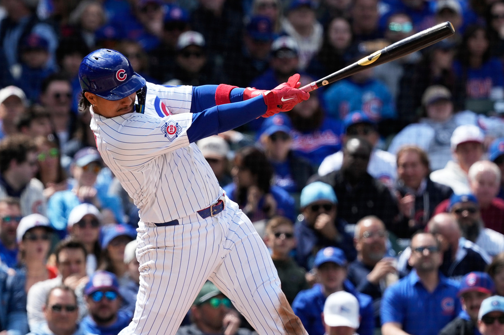 Chicago Cubs' Miguel Amaya hits a two-run single during the fourth inning of a baseball game against the Cincinnati Reds in Chicago, Thursday, May 7, 2026. (AP Photo/Nam Y. Huh)