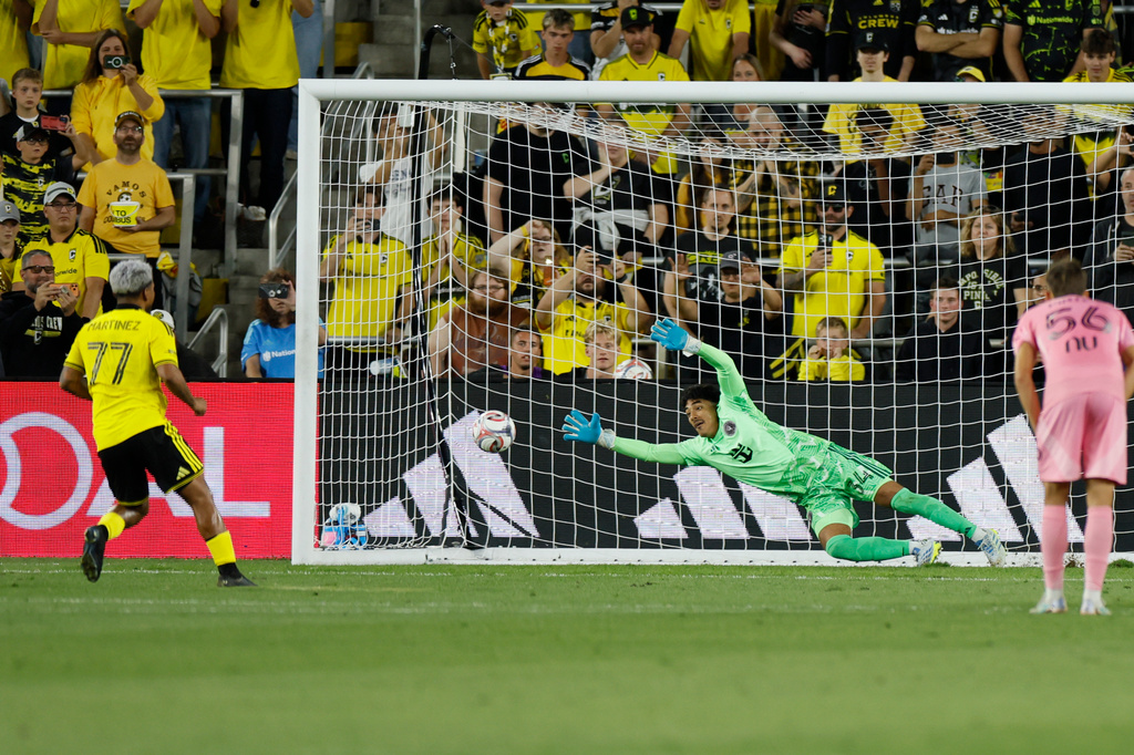 Columbus Crew's Josef Martínez, left, scores a goal against Inter Miami's Rocco Rios Novo during the first half of an MLS soccer match, Sunday, Sept. 27, 2026, in Columbus, Ohio. (AP Photo/Jay LaPrete)