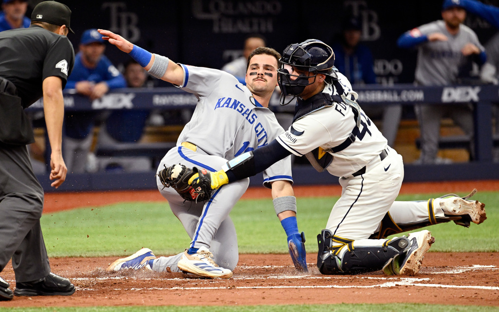 Kansas City Royals' Michael Massey scores on a Lane Thomas double before the tag from Tampa Bay Rays catcher Nick Fortes (40) during the second inning of a baseball game, Monday, June 22, 2026, in St. Petersburg, Fla. (AP Photo/Jason Behnken)