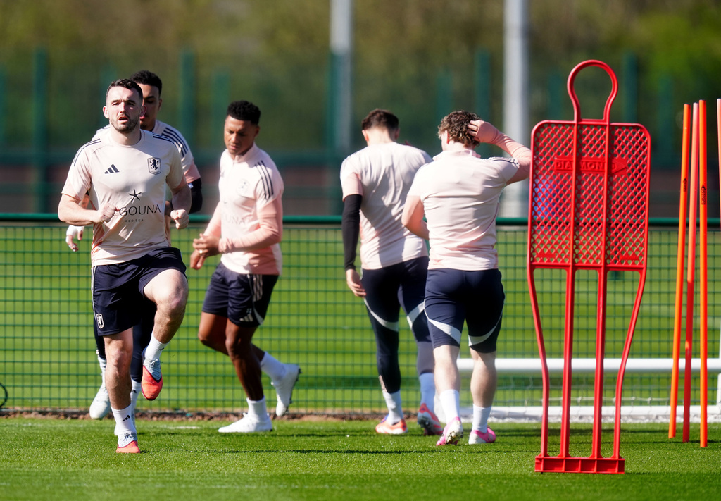 Aston Villa players warm up during a training session in Tamworth, England, Wednesday March 18, 2026, one day ahead of their Europa League soccer match against Lille. (David Davies/PA via AP)