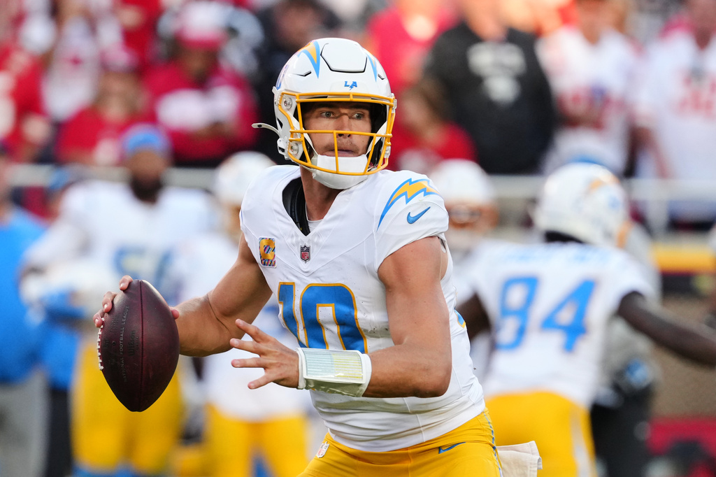 Los Angeles Chargers quarterback Justin Herbert (10) throws a pass during the second half of an NFL football game against the Kansas City Chiefs in Kansas City, Mo., Sunday, Oct. 18, 2026. (AP Photo/Ed Zurga)