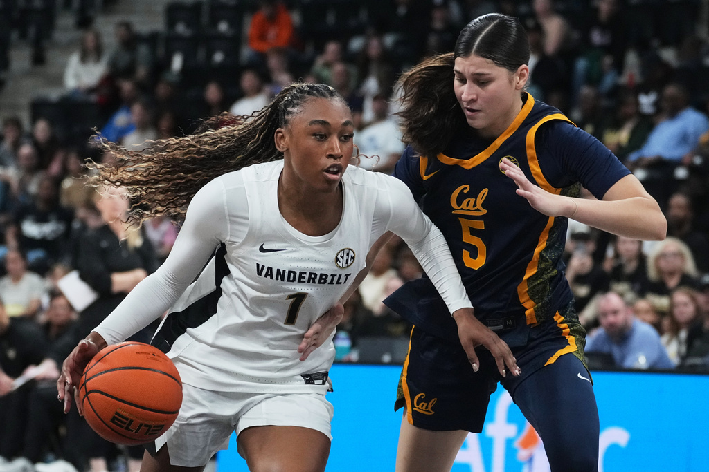 Vanderbilt guard Mikayla Blakes (1) drives on California guard Lola Donez (5) in the first half of an NCAA college basketball game Monday, Nov. 3, 2025 in Paris. (AP Photo/Thibault Camus)