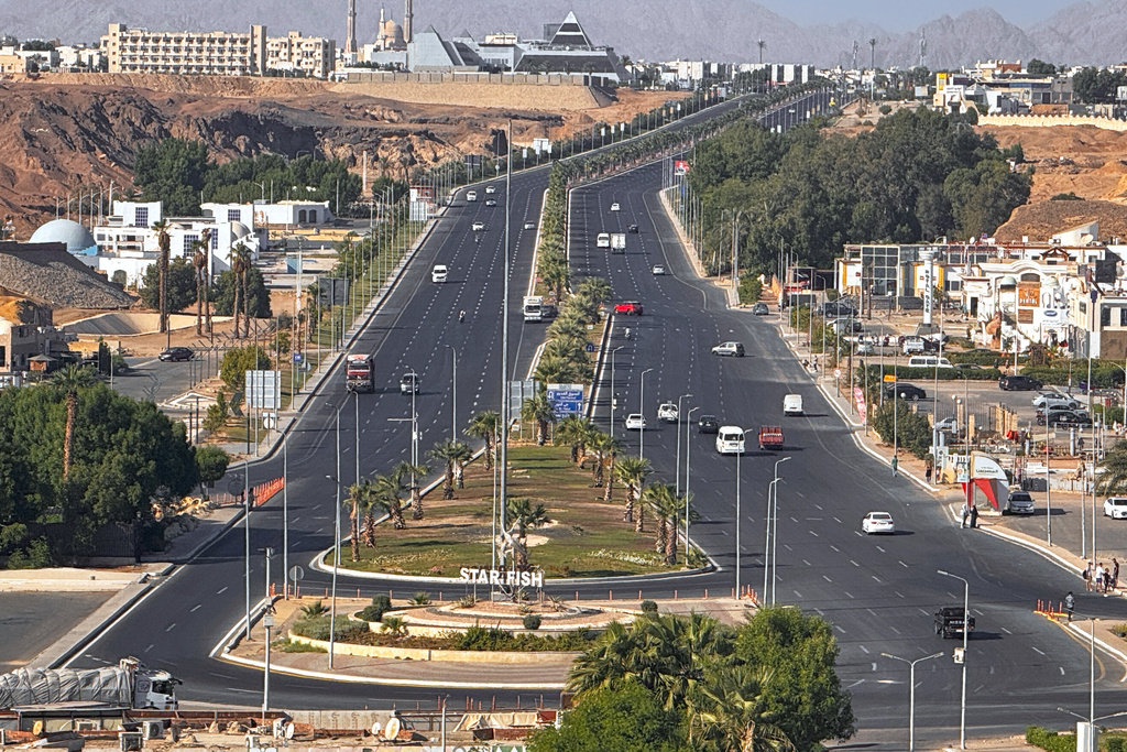 Vehicle drive on the main road in Sharm el-Sheikh, Egypt, where Israeli and Hamas officials are set to hold indirect talks, Monday, Oct. 6, 2025. (AP Photo/Ahmed Hassan)
