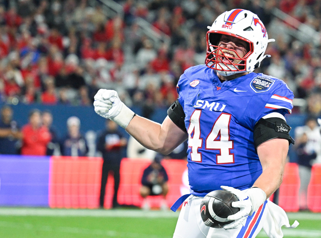 SMU tight end Stone Eby (44) celebrates after scoring a touchdown during the first half of the Holiday Bowl NCAA college football game against Arizona Friday, Jan. 2, 2026, in San Diego. (AP Photo/Denis Poroy)