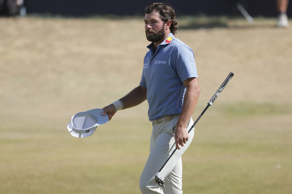 Cameron Young of the United States acknowledges the crowd as he walks off the 18th green after completing his final round during the final day of the British Open Golf championships at Royal Birkdale golf club, in Southport, England, Sunday, July 19, 2026. (AP Photo/Peter Morrison)