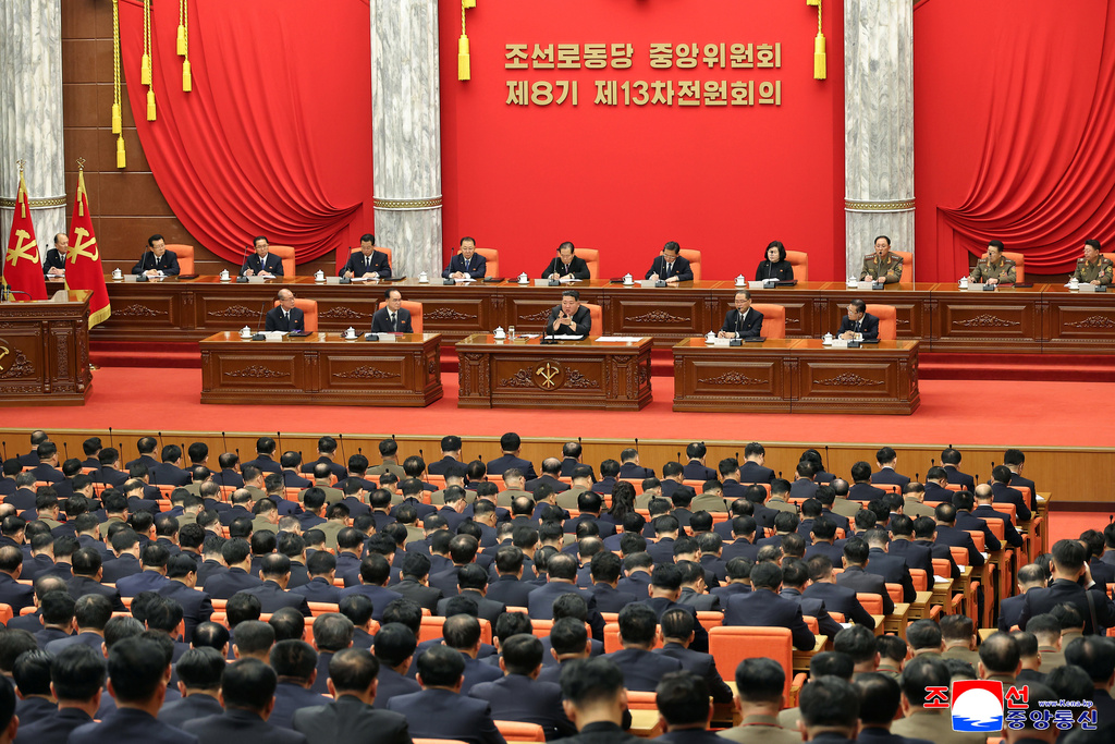 In this photo provided by the North Korean government, North Korean leader Kim Jong Un, center, attends a plenary meeting of the Workers Party's Central Committee in North Korea, Tuesday, Dec. 9, 2025. Independent journalists were not given access to cover the event depicted in this image distributed by the North Korean government. The content of this image is as provided and cannot be independently verified. Korean language watermark on image as provided by source reads: "KCNA" which is the abbreviation for Korean Central News Agency. (Korean Central News Agency/Korea News Service via AP)