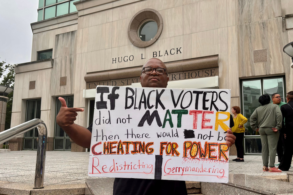 Travis Jackson stands outside the federal courthouse on Friday, May 22, 2026, in Birmingham, Ala. after a court hearing related to redistricting litigation. (AP Photo/Kim Chandler)