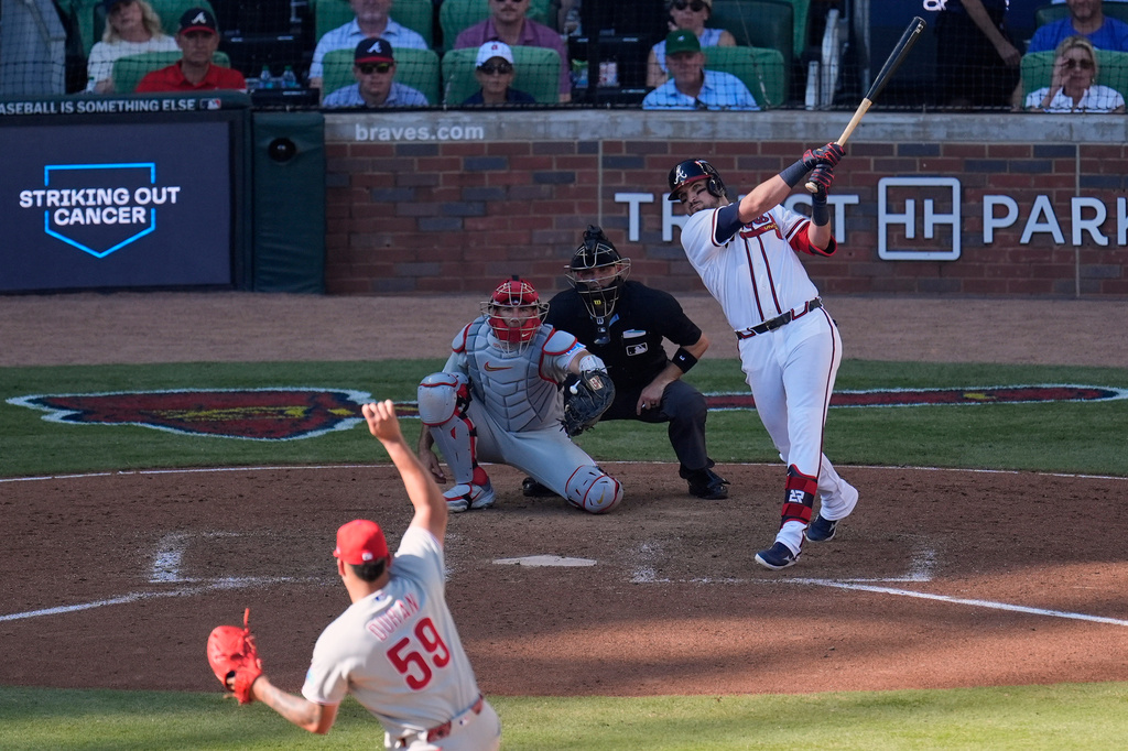 Atlanta Braves' Austin Riley hits a three-run home run off Philadelphia Phillies pitcher Jhoan Duran (59) in the eighth inning during Game 1 of baseball's National League Wild Card Series Tuesday, Sept. 29, 2026, in Atlanta. (AP Photo/Mike Stewart)