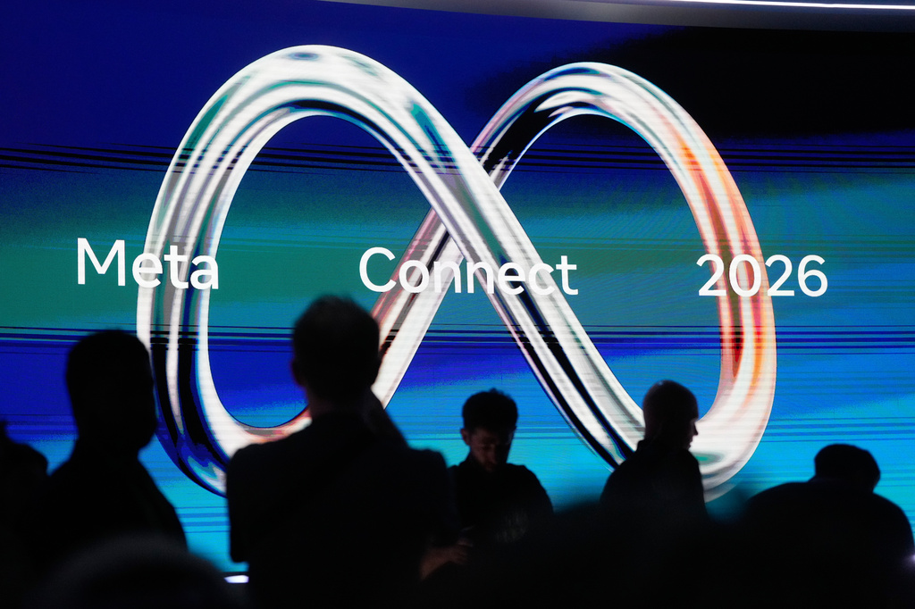 Attendees wait for Meta CEO Mark Zuckerberg's keynote address during the Meta Connect conference, Wednesday, Sept. 23, 2026, in Menlo Park, Calif. (AP Photo/Jeff Chiu)
