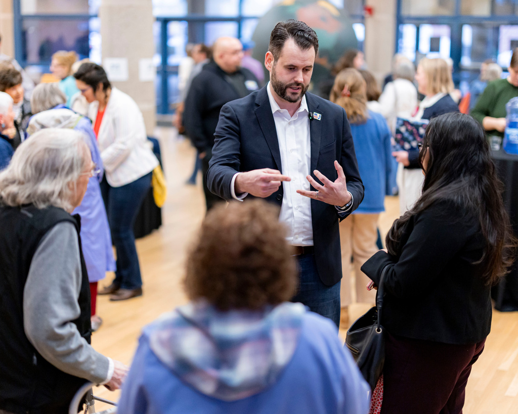 Iowa state Sen. Zach Wahls talks with community members following a candidates forum at the State of Iowa Historical Building in Des Moines, Iowa, Wednesday, April 8, 2026. (Nick Rohlman/The Gazette via AP)