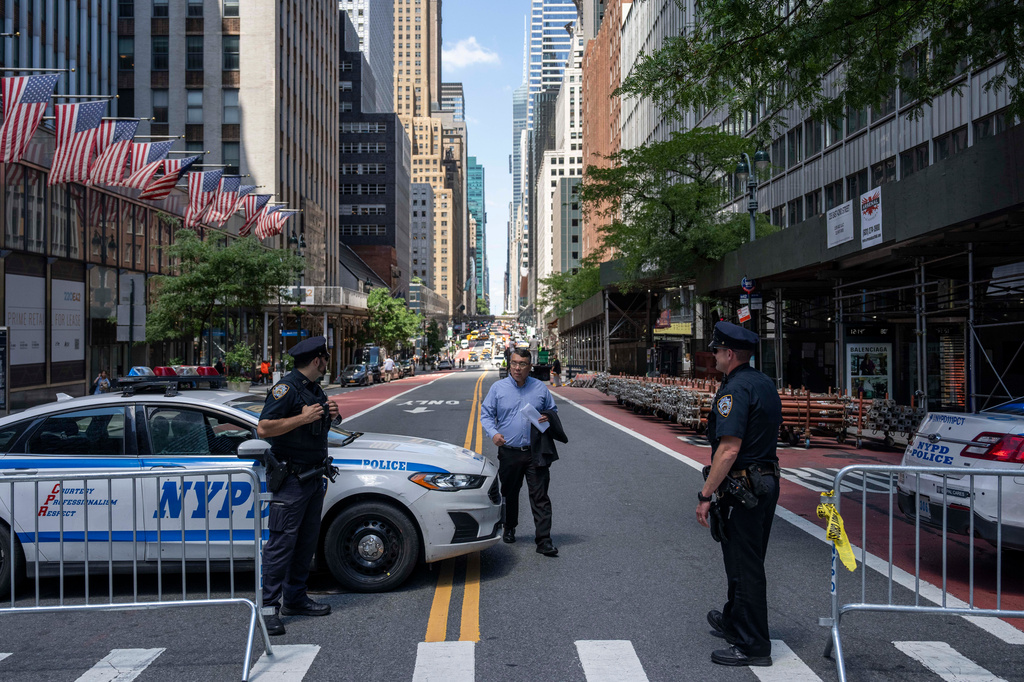 Police officers stand on the closed street near 235 East 42nd Street, Wednesday, July 8, 2026, in New York. (AP Photo/Yuki Iwamura)