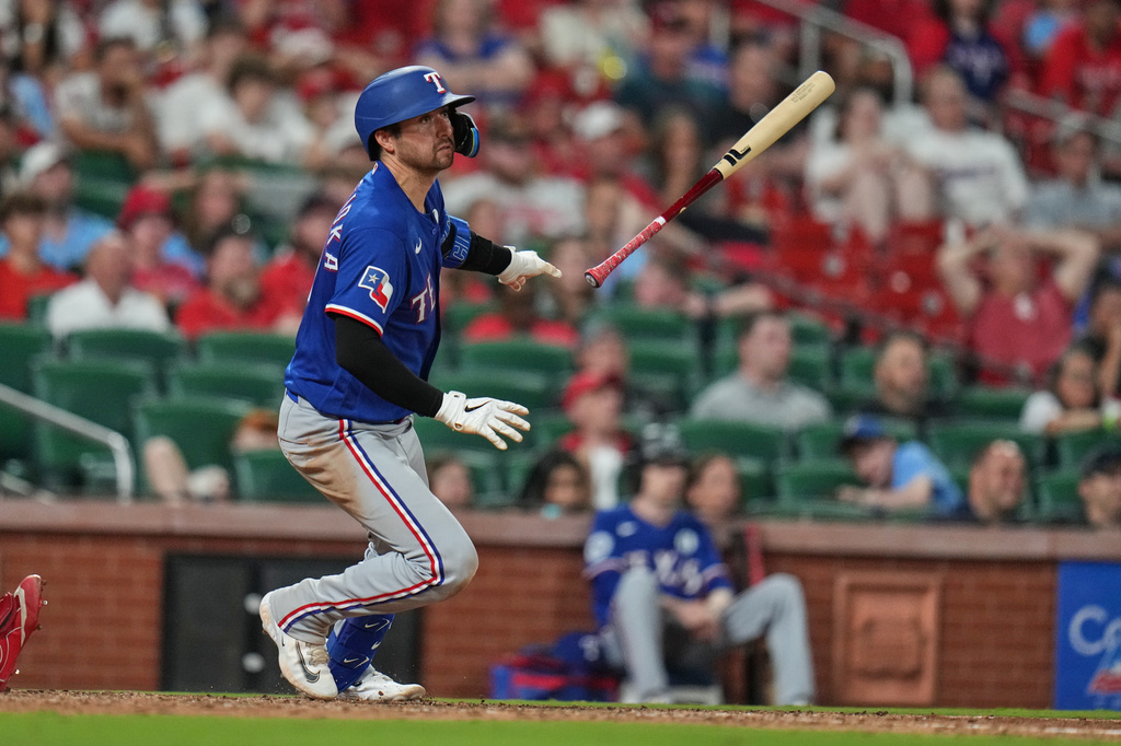 Texas Rangers' Kyle Higashioka singles during the ninth inning of a baseball game against St. Louis Cardinals Tuesday, June 2, 2026, in St. Louis. (AP Photo/Jeff Roberson)