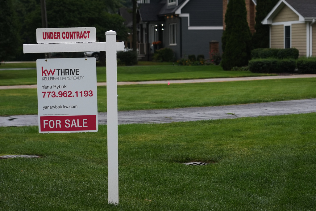 For sale sign is seen outside of a home in Arlington Heights, Ill., Wednesday, Sept. 16, 2026. (AP Photo/Nam Y. Huh)