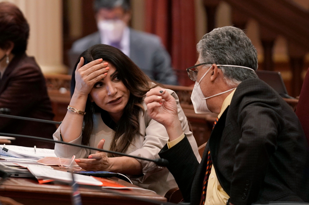 FILE - State Sen. Susan Rubio, D-Baldwin Park, talks with Sen. Anthony Portantino, D-La Canada Flintridge, at the Capitol in Sacramento, Calif., June 29, 2022. (AP Photo/Rich Pedroncelli, File)