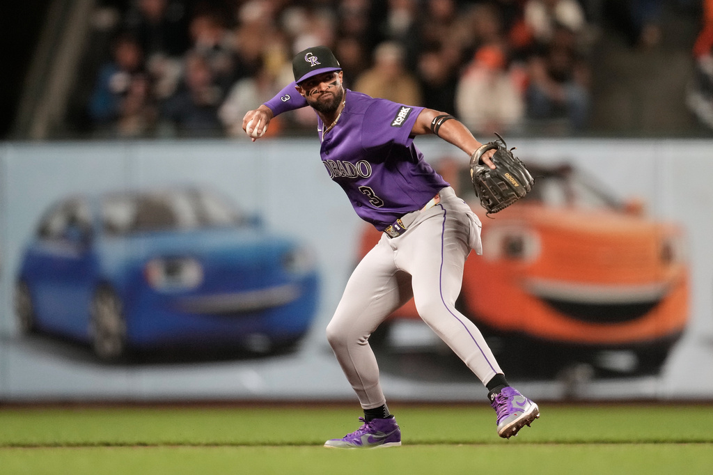 Colorado Rockies third baseman Willi Castro throws out San Francisco Giants' Osleivis Basabe at first base during the seventh inning of a baseball game, Friday, Aug. 14, 2026, in San Francisco. (AP Photo/Jeff Chiu)