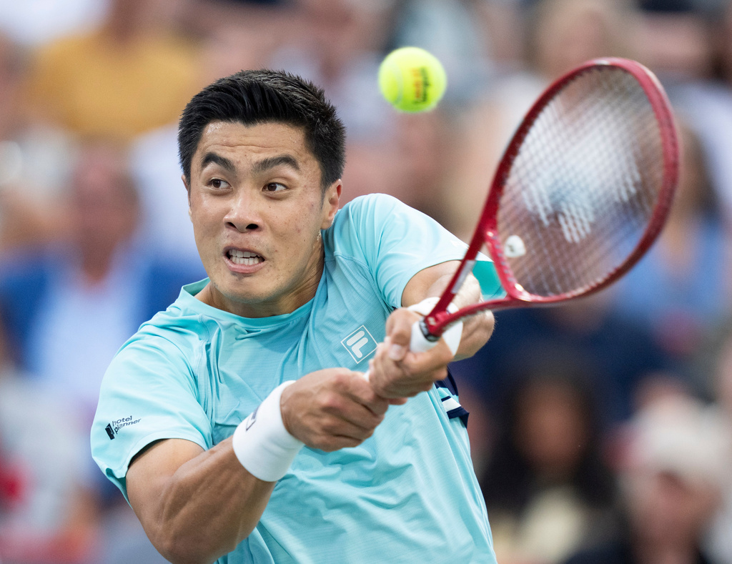 Brandon Nakashima of the United States hits a return to Rafael Jodar of Spain during a semifinal tennis match at the National Bank Open in Montreal, Wednesday, Aug. 12, 2026. (Christinne Muschi/The Canadian Press via AP)