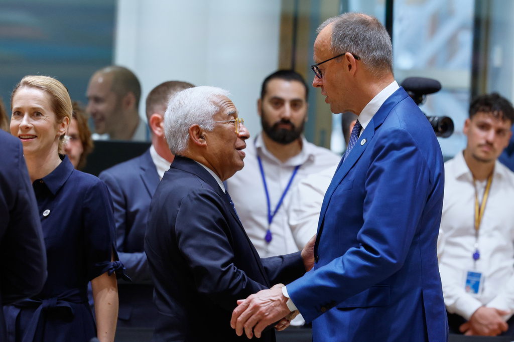 Germany's Chancellor Friedrich Merz, right, talks to European Council President Antonio Costa during a round table meeting at the EU summit in Brussels, Friday, June 19, 2026. (AP Photo/Geert Vanden Wijngaert)