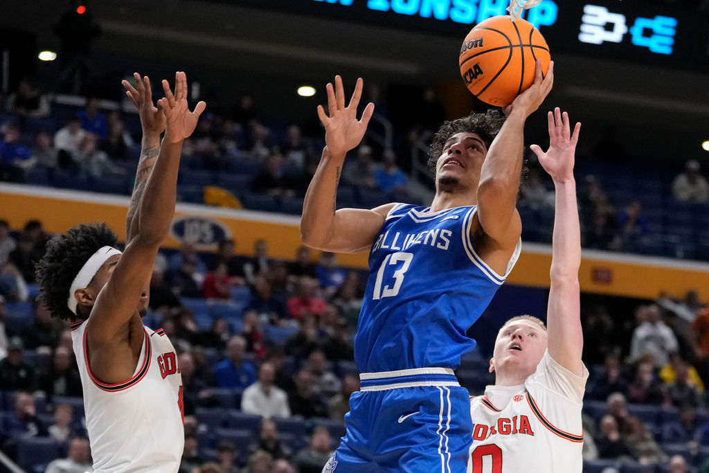 Saint Louis guard Dion Brown (13) shoots over Georgia guard Blue Cain (0) during the second half in the first round of the NCAA college basketball tournament, Thursday, March 19, 2026, in Buffalo, N.Y. (AP Photo/Yuki Iwamura)