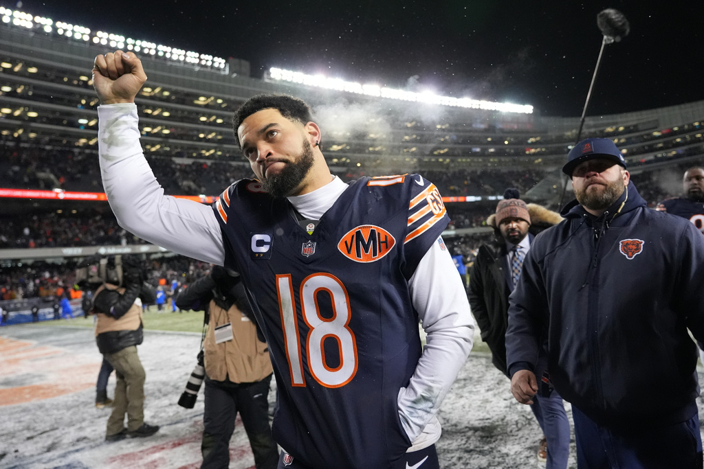 Chicago Bears quarterback Caleb Williams gestures as he leaves the field following his team's overtime loss to the Los Angeles Rams during an NFL football divisional playoff game Sunday, Jan. 18, 2026, in Chicago. (AP Photo/Nam Y. Huh)