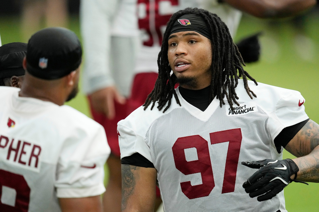 Arizona Cardinals defensive tackle Walter Nolen III (97) talks with Cardinals defensive tackle PJ Mustipher during NFL football training camp, Sunday, July 26, 2026, in Glendale, Ariz. (AP Photo/Ross D. Franklin)