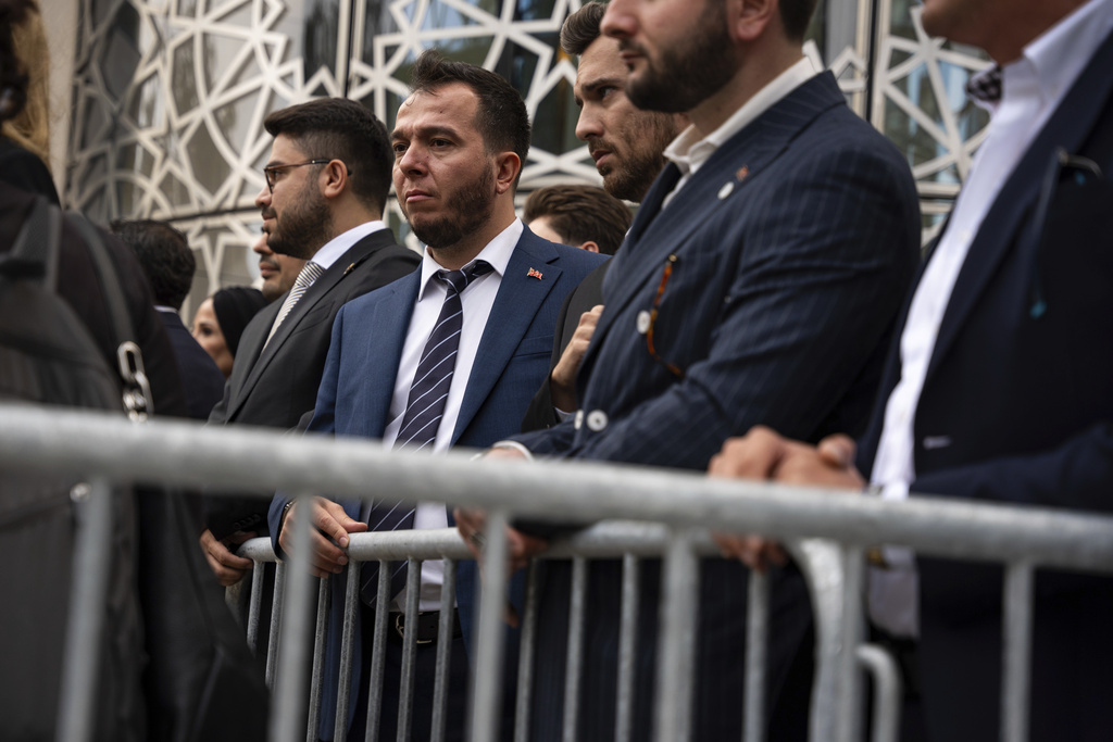 People wait for the Turkish President Recep Tayyip Erdoğan to exit the United Nations Headquarters on the first day of the 80th session of the UN General Assembly's High-Level week, Monday, Sept. 22, 2025. (AP Photo/Angelina Katsanis)