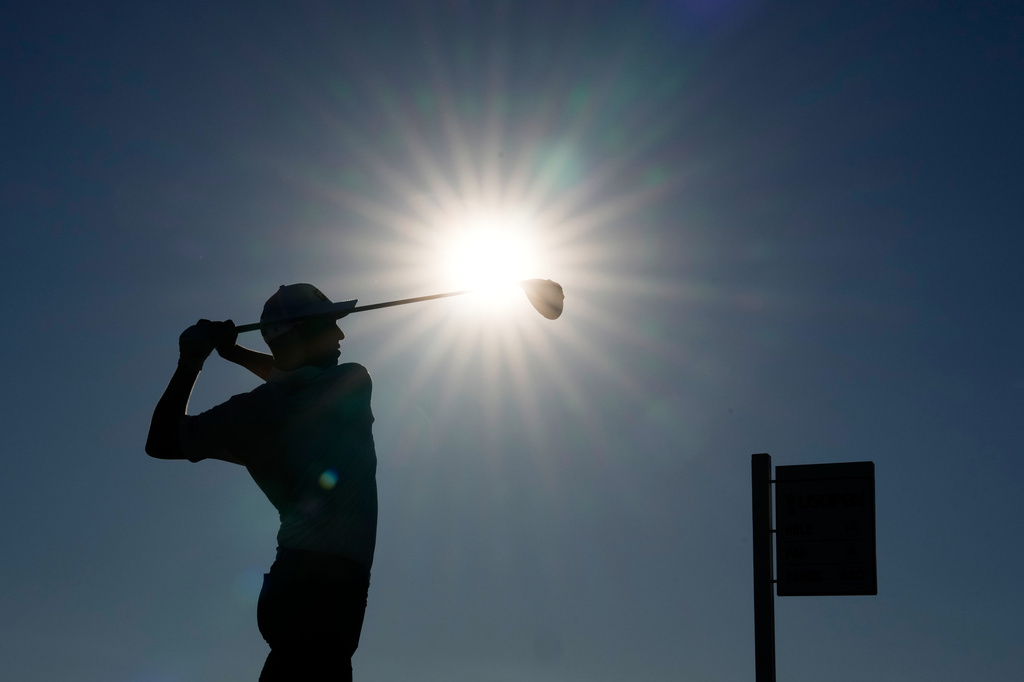 Sam Stevens watches his tee shot on the 14th hole during the third round of the U.S. Open golf tournament at Shinnecock Hills Golf Club in Southampton, N.Y., Saturday, June 20, 2026.(AP Photo/David J. Phillip)