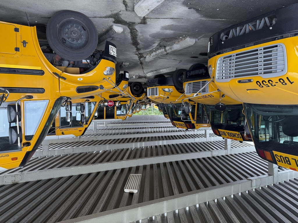 School buses sit inside the Dayton Public Schools Transportation center on Thursday, Aug. 21, 2025 in Dayton, Ohio. (AP Photo/Patrick Aftoora-Orsagos)