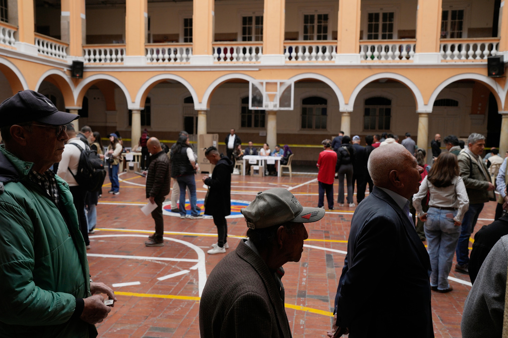 Voters line up at a polling station during the presidential election in Bogota, Colombia, Sunday, May 31, 2026. (AP Photo/Matias Delacroix)