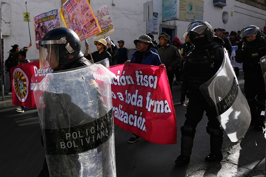Police escort teachers during an anti-government protest in La Paz, Bolivia, Tuesday, Sept. 15, 2026. (AP Photo/Juan Karita)