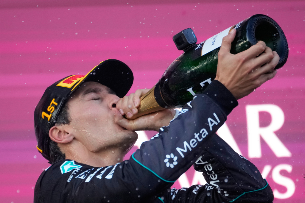 Mercedes driver George Russell of Britain celebrates after winning the Azerbaijan F1 Grand Prix auto race, in Baku, Azerbaijan, Saturday, Sept. 26, 2026. (AP Photo/Pavel Bednyakov)