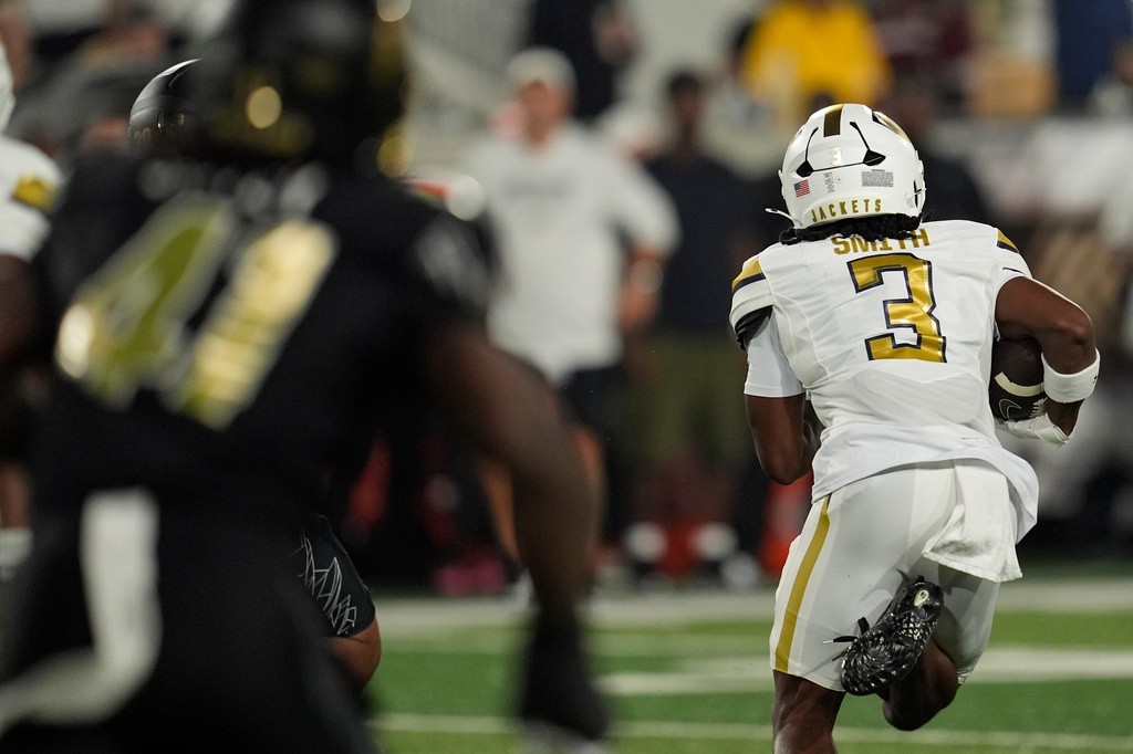 Georgia Tech cornerback Rahkeem Smith (3) runs a kickoff for a touchtown against Colorado during the first half of an NCAA college football game, Thursday, Sept. 3, 2026, in Atlanta. (AP Photo/Mike Stewart)
