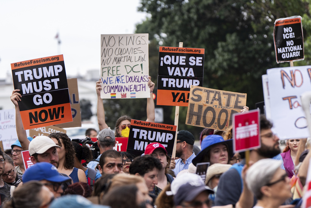 Protesters demonstrate against President Donald Trump's planned use of federal law enforcement and National Guard troops in Washington, during a rally in front of the White House, Monday, Aug. 11, 2025, in Washington. (AP Photo/Julia Demaree Nikhinson)