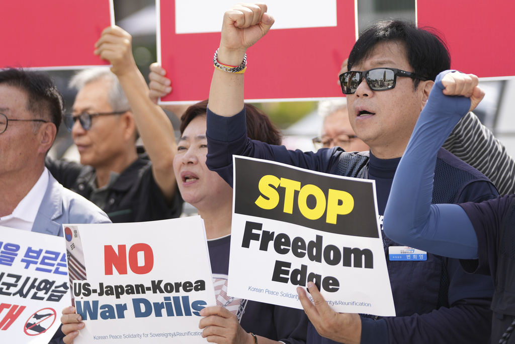 Protesters shout slogans during a press conference to oppose the military exercise called Freedom Edge in Seoul, South Korea, Monday, Sept. 15, 2025. (AP Photo/Lee Jin-man)