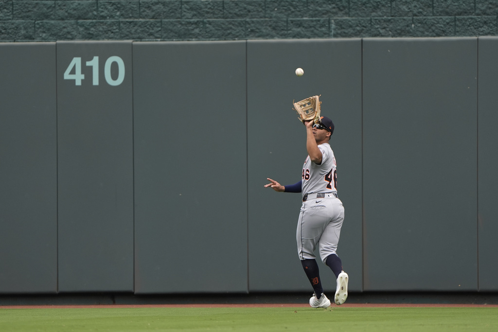 Detroit Tigers center fielder Wenceel Perez catches a fly ball for the out on Kansas City Royals' Maikel Garcia during the first inning of a baseball game Sunday, Aug. 31, 2025, in Kansas City, Mo. (AP Photo/Charlie Riedel)
