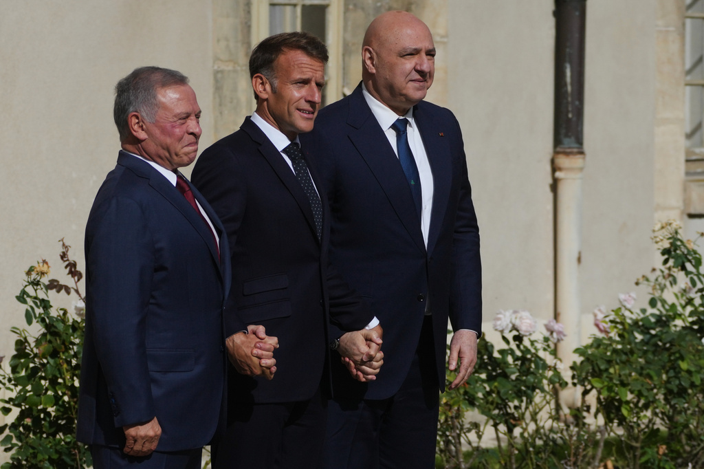 French President Emmanuel Macron, center, Jordan's King Abdullah II, left, and Lebanese President Joseph Aoun pose before a meeting at the Hotel des Invalides in Paris, Thursday Sept. 17, 2026. (AP Photo/Thibault Camus)