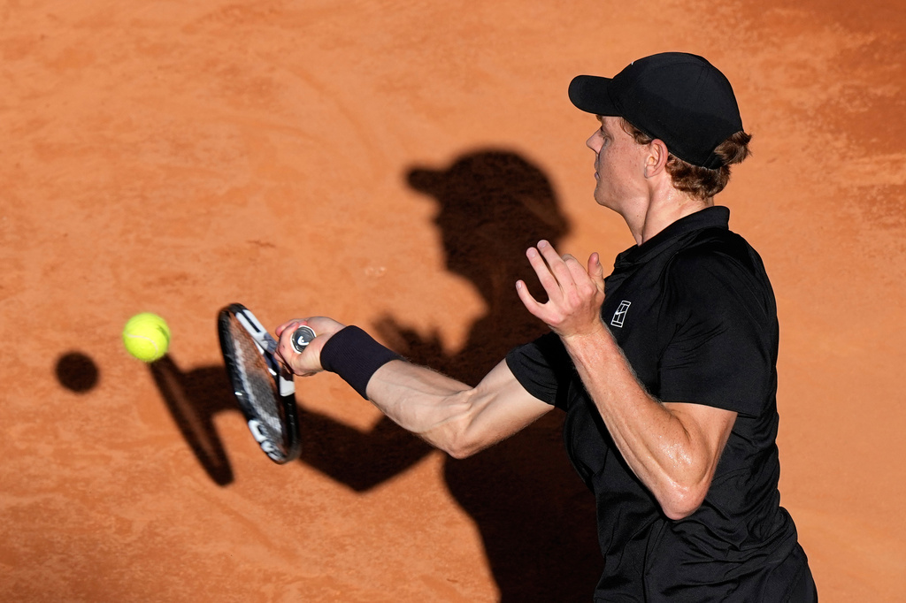 Jannik Sinner, of Italy, returns the ball to Casper Ruud, of Norway, during the final match at the Italian Open tennis tournament, in Rome, Sunday, May 17, 2026. (AP Photo/Alessandra Tarantino)