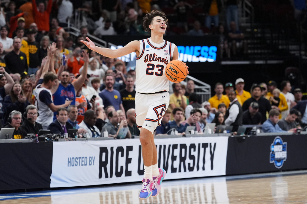 FILE - Illinois' Keaton Wagler celebrates after Illinois beat Iowa in an Elite Eight game in the NCAA college basketball tournament, March 28, 2026, in Houston. (AP Photo/Eric Gay, File)