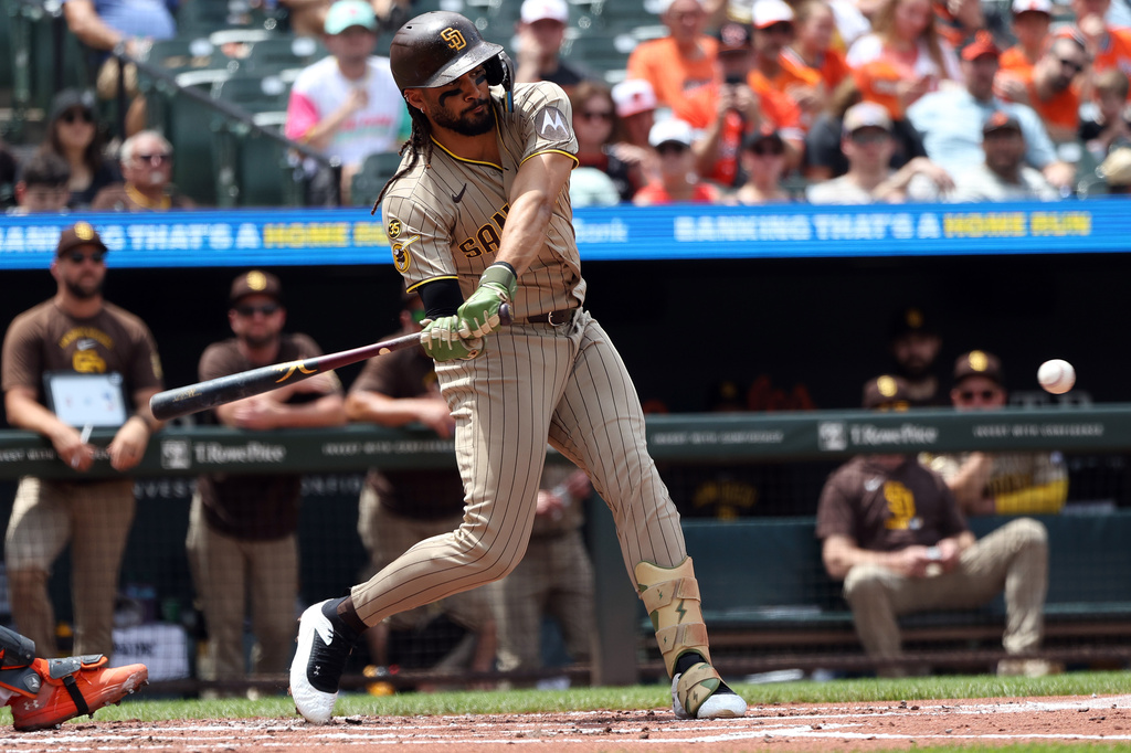 San Diego Padres' Fernando Tatis Jr. hits an RBI single during the second inning of a baseball game against the Baltimore Orioles, Sunday, June 14, 2026, in Baltimore. (AP Photo/Daniel Kucin Jr.)
