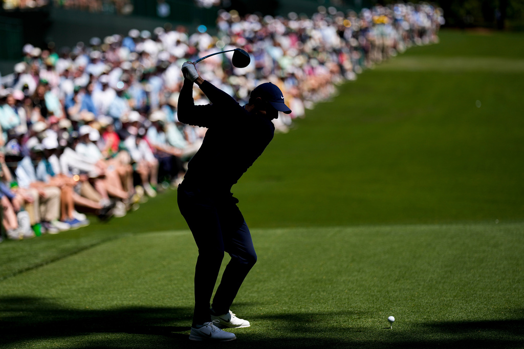 Rory McIlroy, of Northern Ireland, hits his tee shot on the 14th hole during the first round of the Masters golf tournament at the Augusta National Golf Club, Thursday, April 9, 2026, in Augusta, Ga. (AP Photo/David J. Phillip)