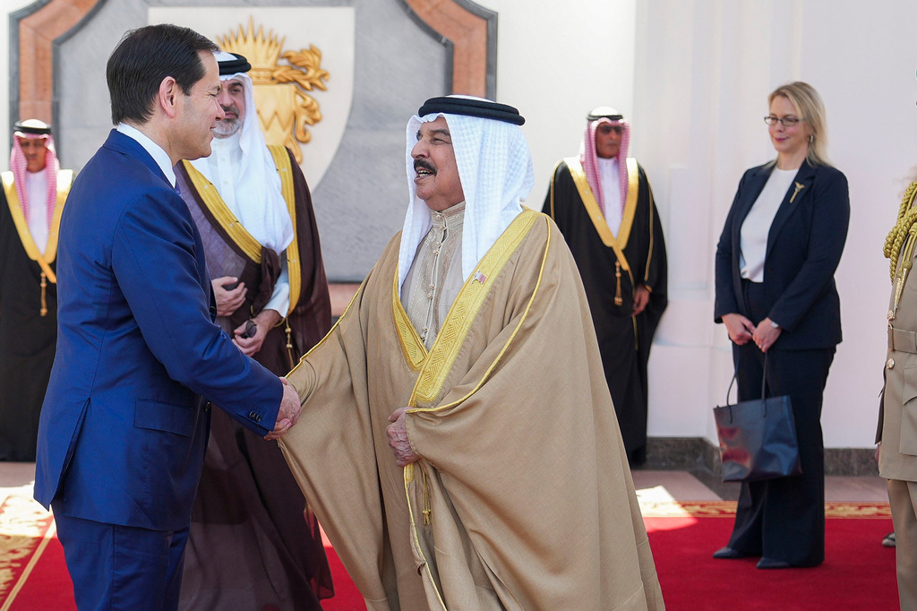 U.S. Secretary of State Marco Rubio, left, and Bahrain's King Hamad bin Isa Al Khalifa salute eachother after their meeting as U.S. Ambassador to Bahrain Stephanie Hallett looks on at right, at Al-Sakhir Palace near Zallaq, Bahrain Thursday, June 25, 2026. U.S. Ambassador to Bahrain Stephanie Hallett. (Eric Lee/Pool Photo via AP)