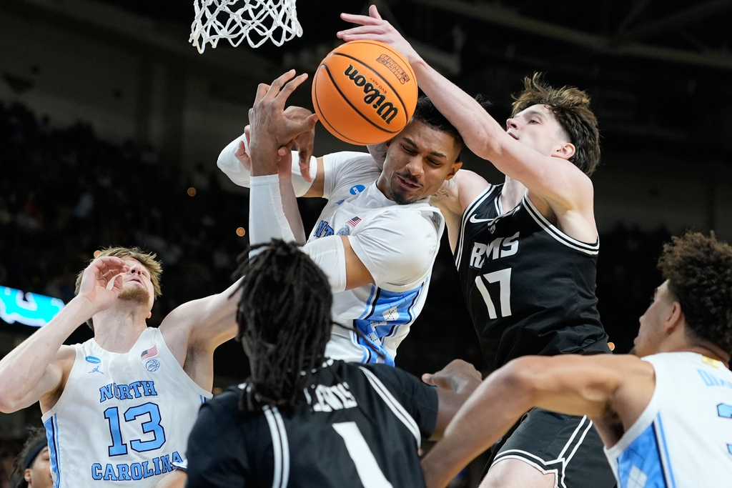 North Carolina forward Jarin Stevenson, top left, rebounds the ball during the first half in the first round of the NCAA college basketball tournament against Virginia Commonwealth, Thursday, March 19, 2026, in Greenville, S.C. (AP Photo/Brynn Anderson)