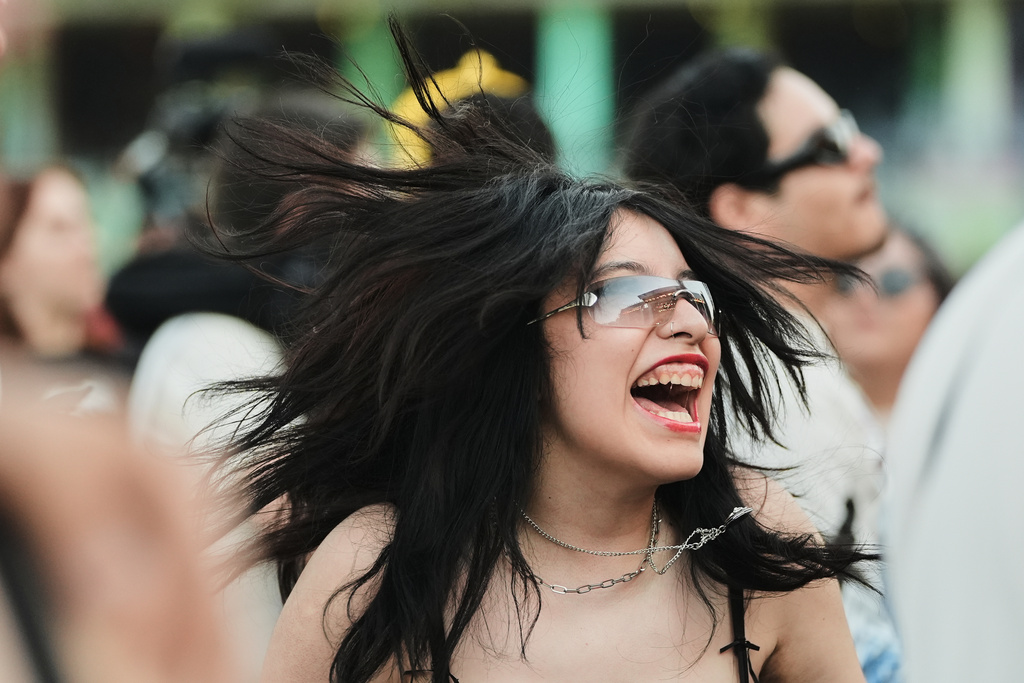 A fan of U.S. singer Lyrah sings during her concert at the Corona Capital music festival in Mexico City, Saturday, Nov. 15, 2025. (AP Photo/Claudia Rosel)