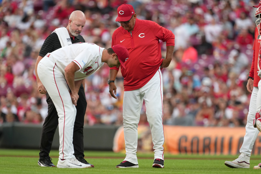 Cincinnati Reds' Nick Lodolo reacts after being hit by a ball off the bat of Milwaukee Brewers' Jackson Chourio during the fourth inning of a baseball game, Tuesday, June 23, 2026, in Cincinnati. (AP Photo/Kareem Elgazzar)