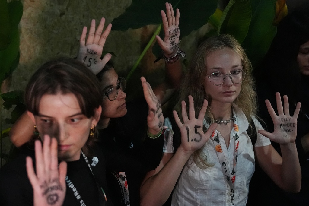 Activists participate in a demonstration outside where negotiations are taking place at the COP30 U.N. Climate Summit, Friday, Nov. 21, 2025, in Belem, Brazil. (AP Photo/Joshua A. Bickel)