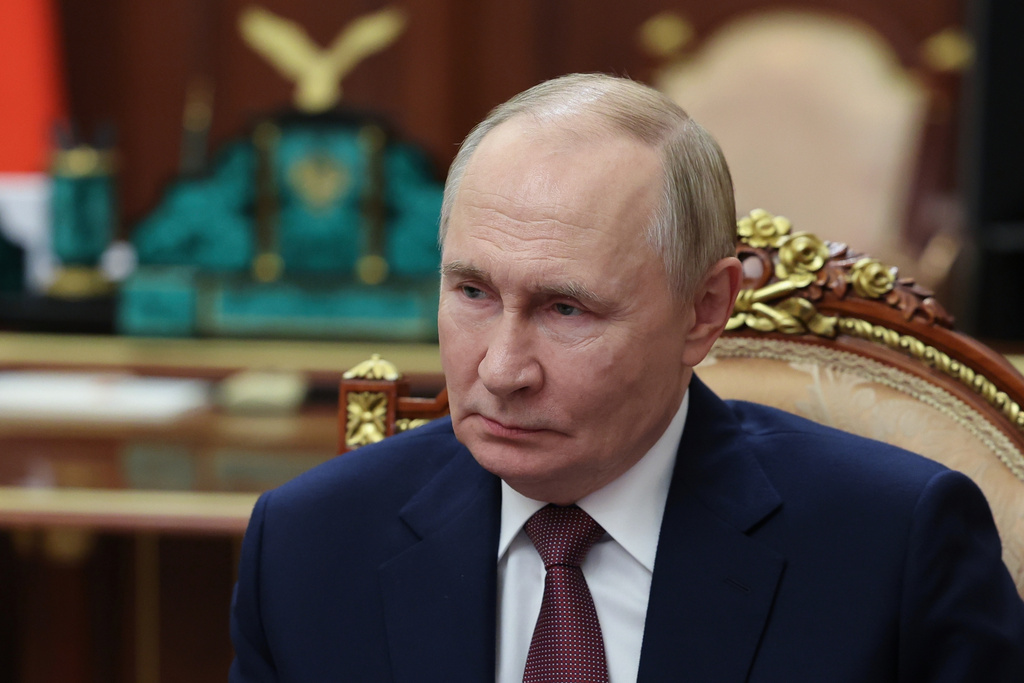 Russian President Vladimir Putin listens to Vitaly Mutko, the chief executive officer of Dom.RF, not pictured, during their meeting at the Kremlin in Moscow, Russia, on Monday, Oct. 20, 2025. (Alexander Kazakov, Sputnik, Kremlin Pool Photo via AP)