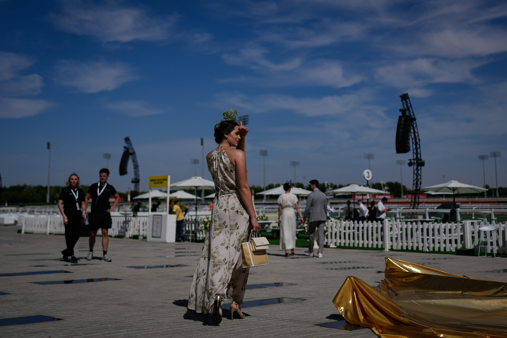 A racegoer arrives at the Meydan Racecourse ahead of the Dubai World Cup, United Arab Emirates, Saturday, March 28, 2026. (AP Photo/Altaf Qadri)